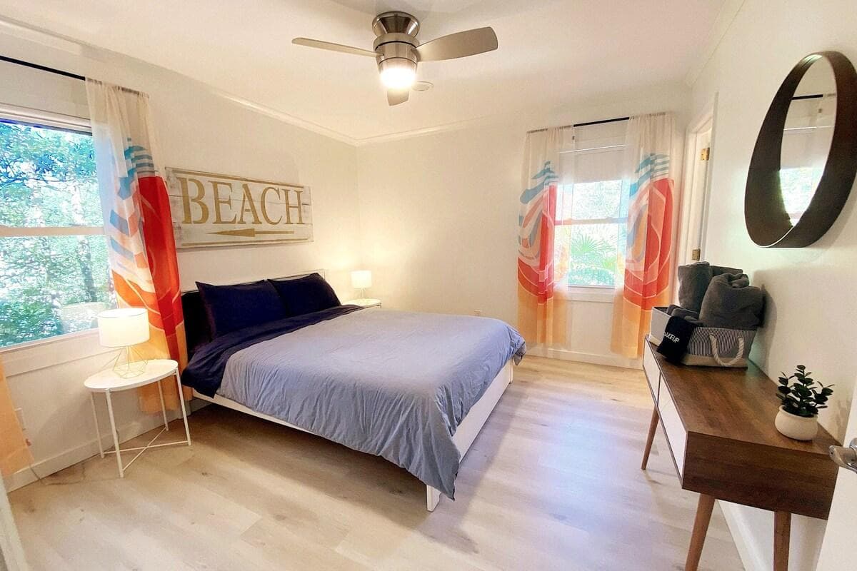 Master bedroom with Queen bed, large closet, desk, and en-suite bathroom with large shower